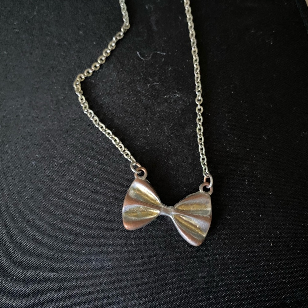 Silver and gold bow necklace